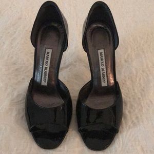 Black open toed patent leather shoes